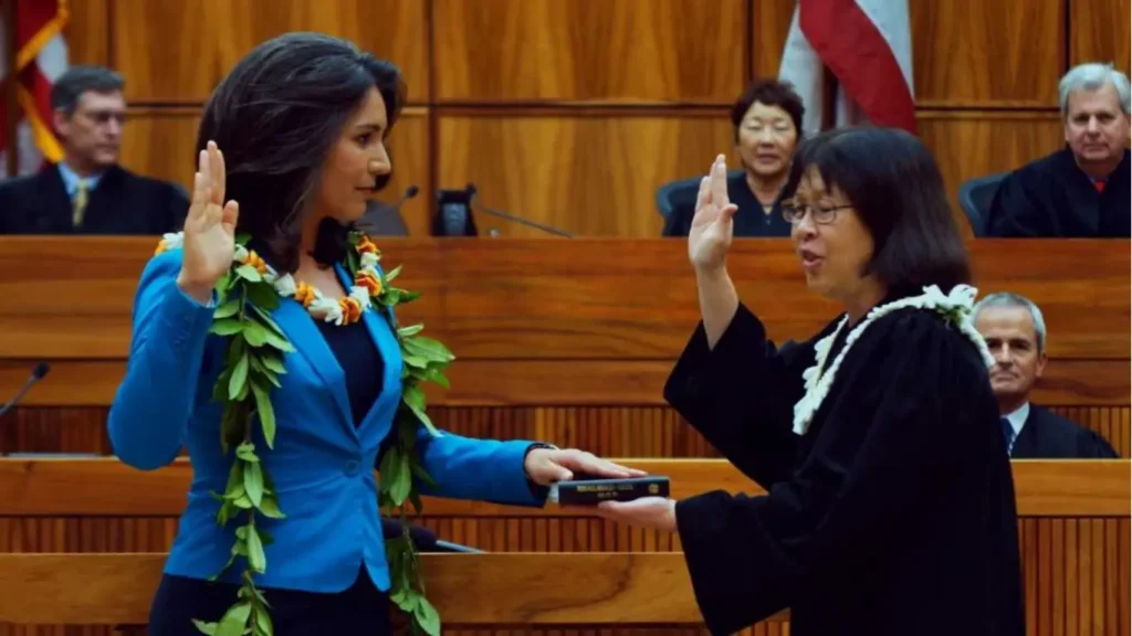 Tulsi Gabbard taking oath with the Bhagavad Gita in hand